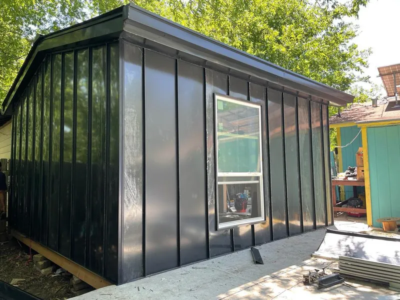 Black standing seam metal wall panels for Metal Roof Installation in Plattsmouth